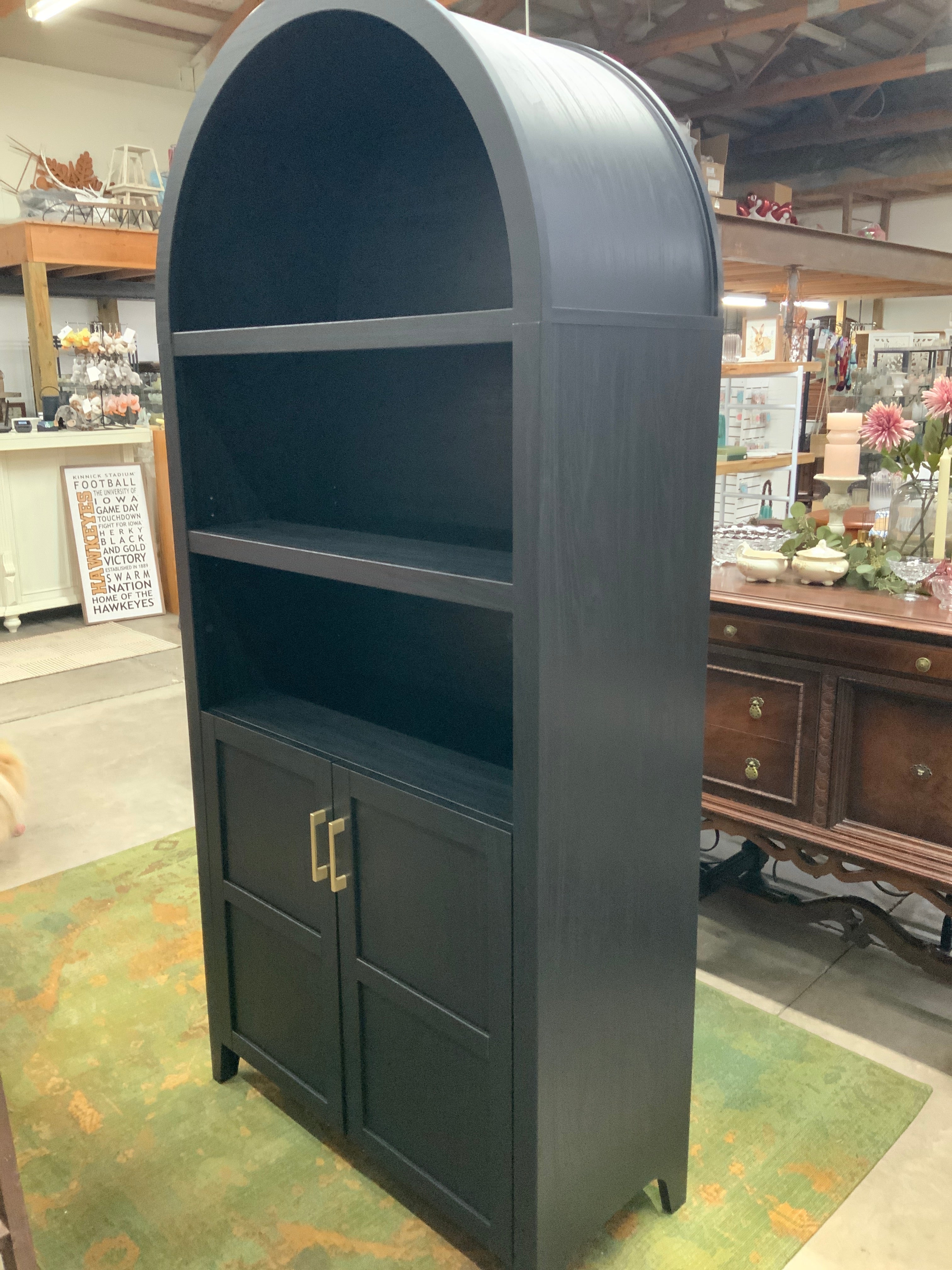 Tall arched bookcase with cabinet